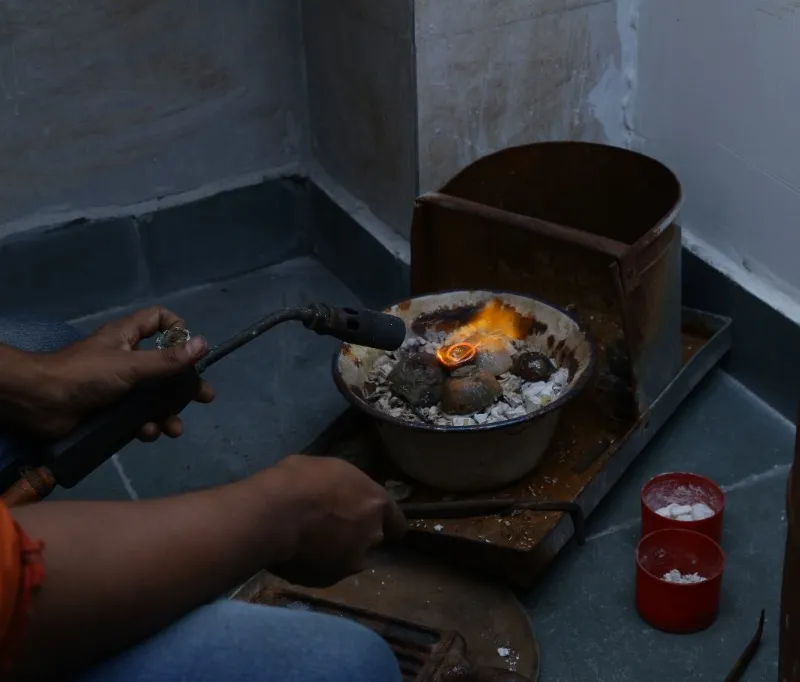 Torch soldering fine jewelry in the atelier
